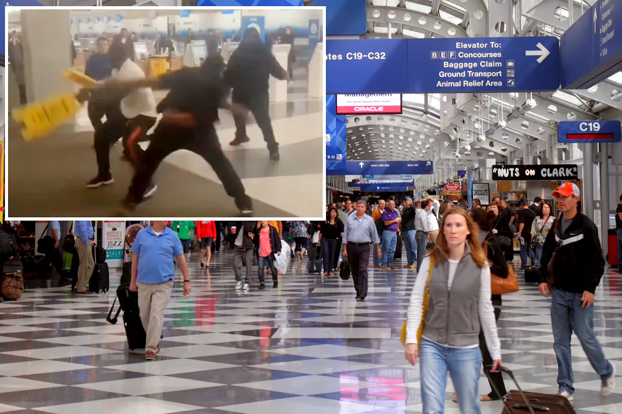 Chicago travelers whack each other with 'wet floor' signs in wild caught-on-video brawl at O'Hare Airport