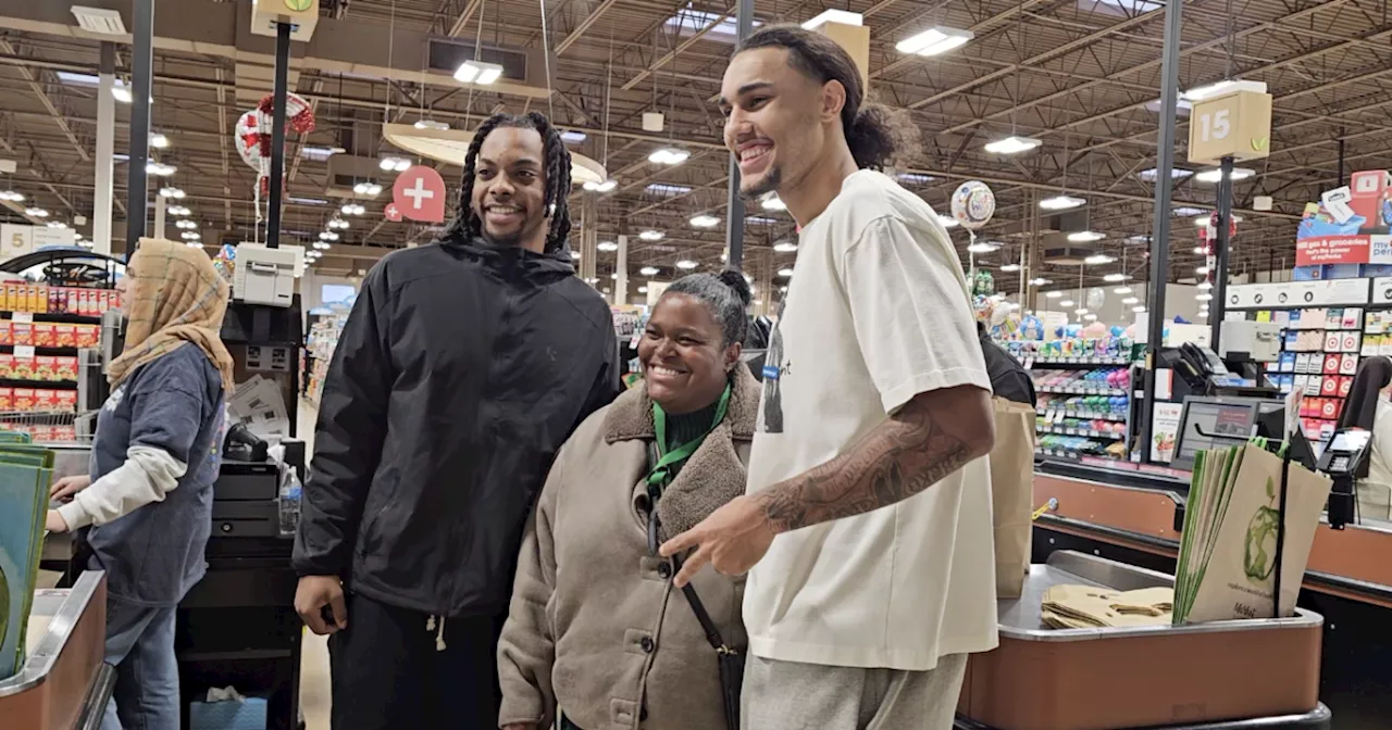 Cavaliers' Garland and Tyson Surprise Shoppers with Holiday Cheer