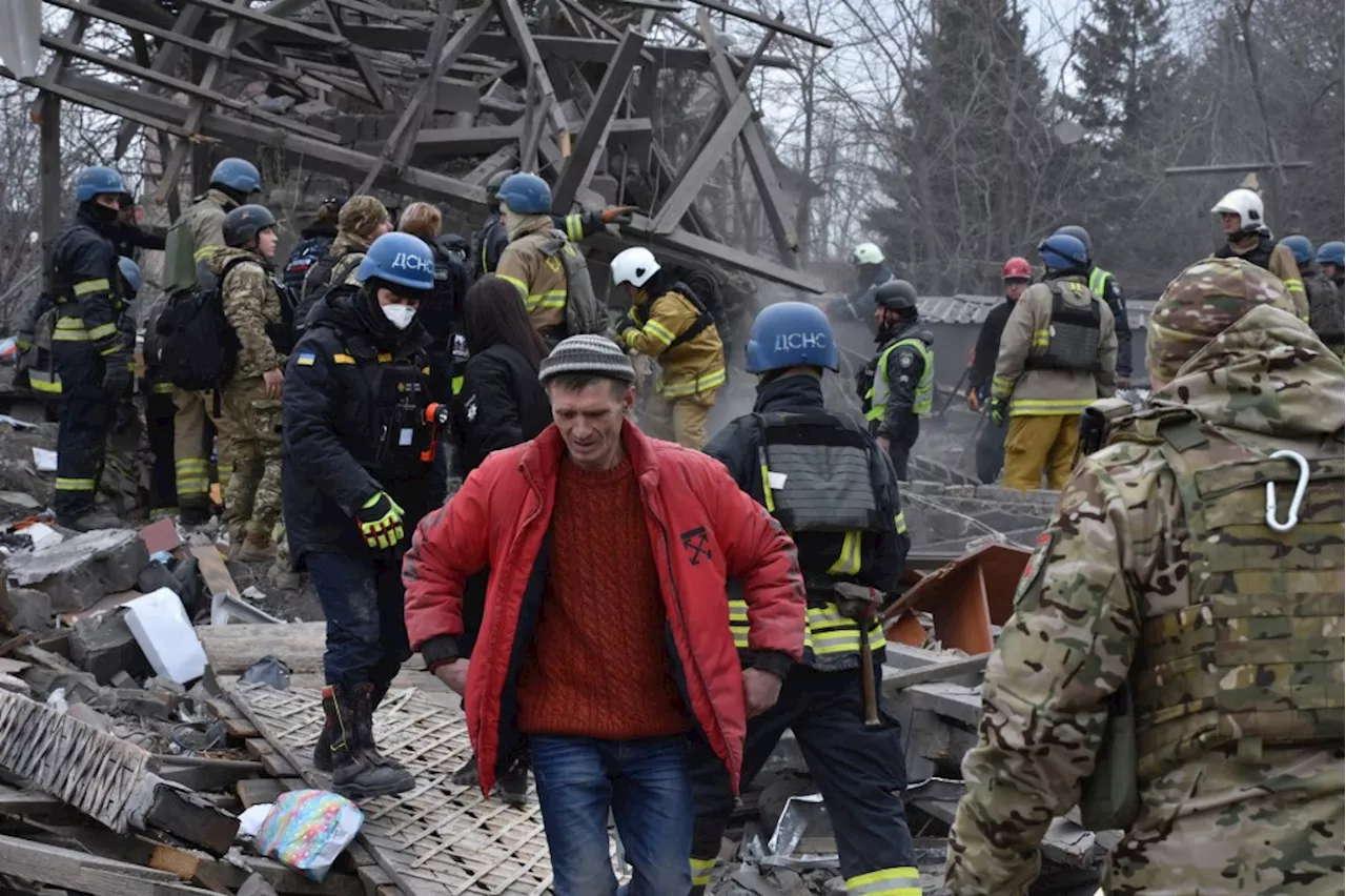 People Clear Debris from Russia's Air Attack in Zaporizhzhia, Ukraine