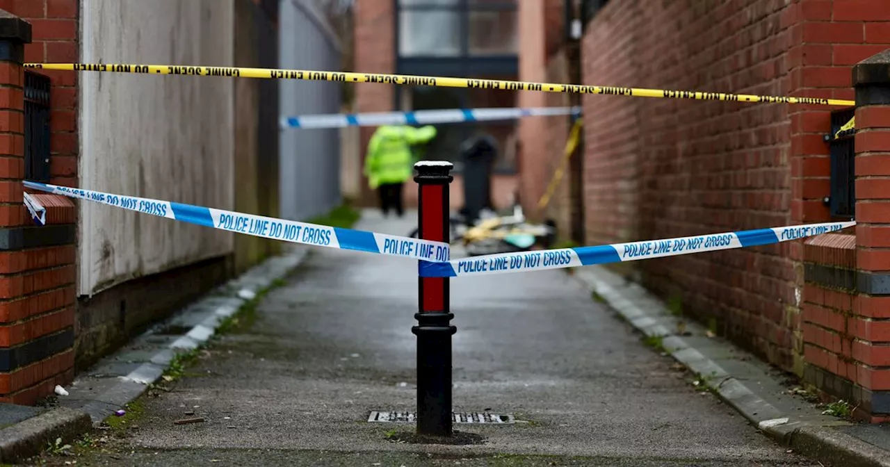 Two in hospital after horror double stabbing as police close off street