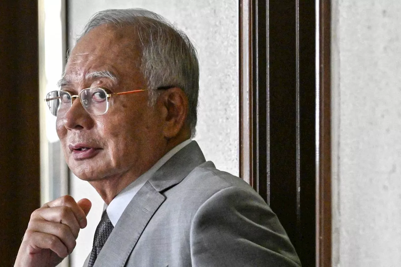 Najib says bribery, power abuse charges 'politically motivated'