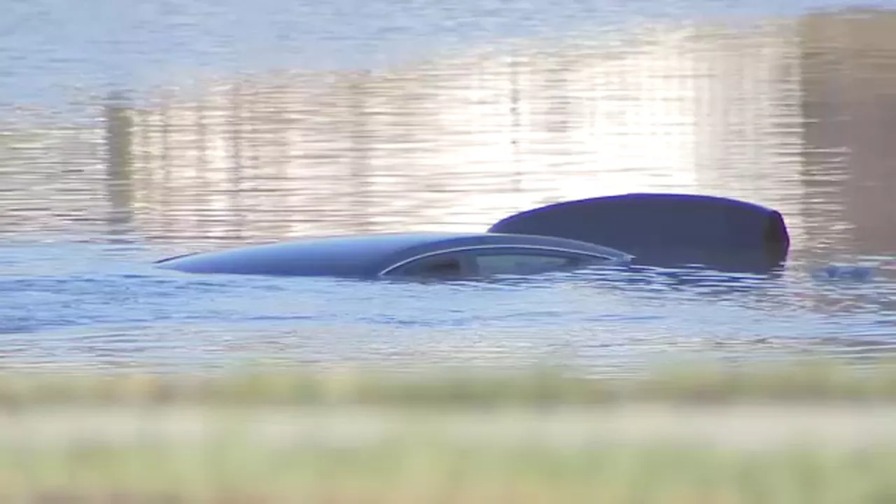 Submerged car found in same neighborhood where man's body was discovered day before, officials say