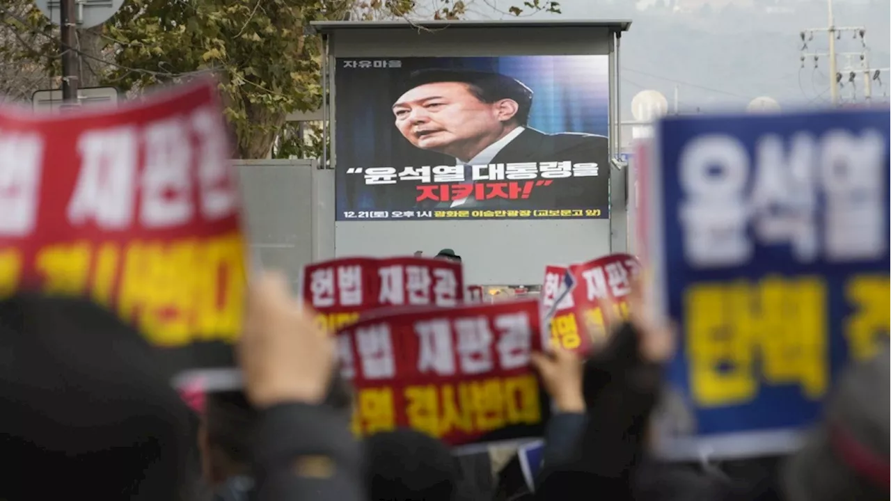 South Korean investigators seek to question reluctant president over martial law