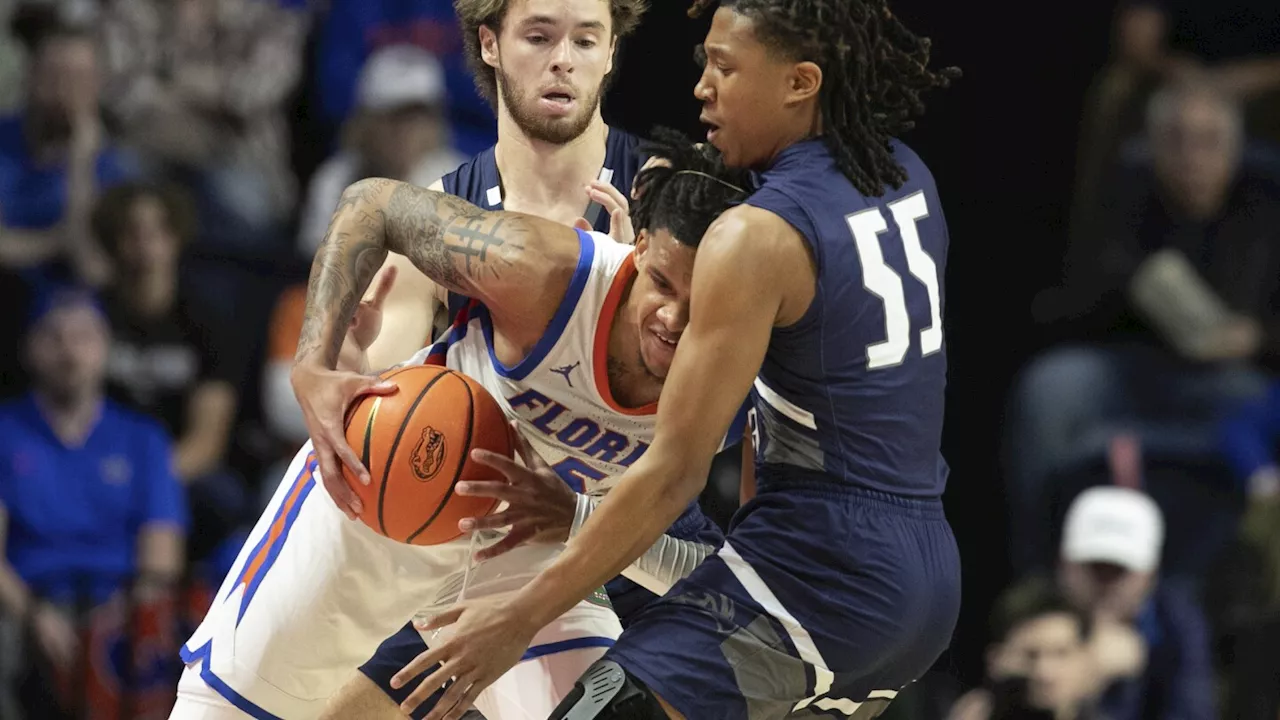 Richard scores a career-high 26 and helps No. 7 Florida beat UNF 99-45 to reach 12-0