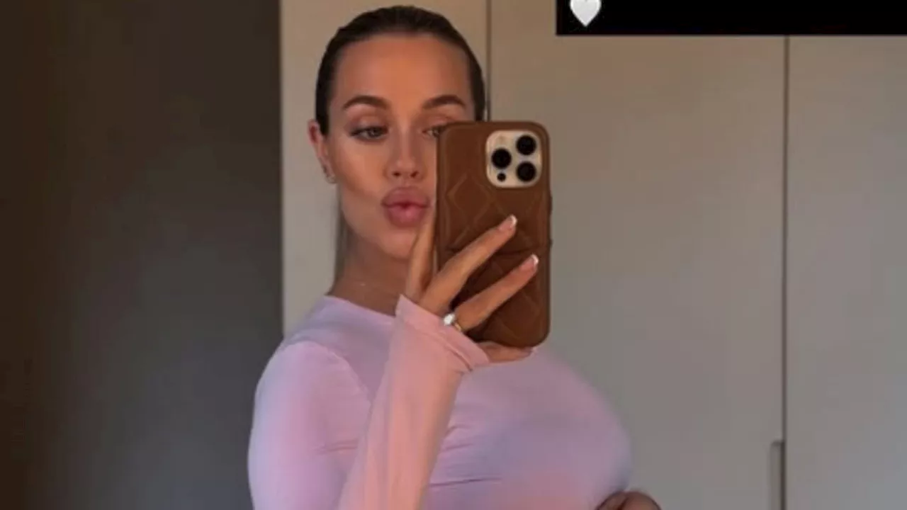 Pregnant Lottie Tomlinson showcases her blossoming bump in stunning snap as she reveals due date and...