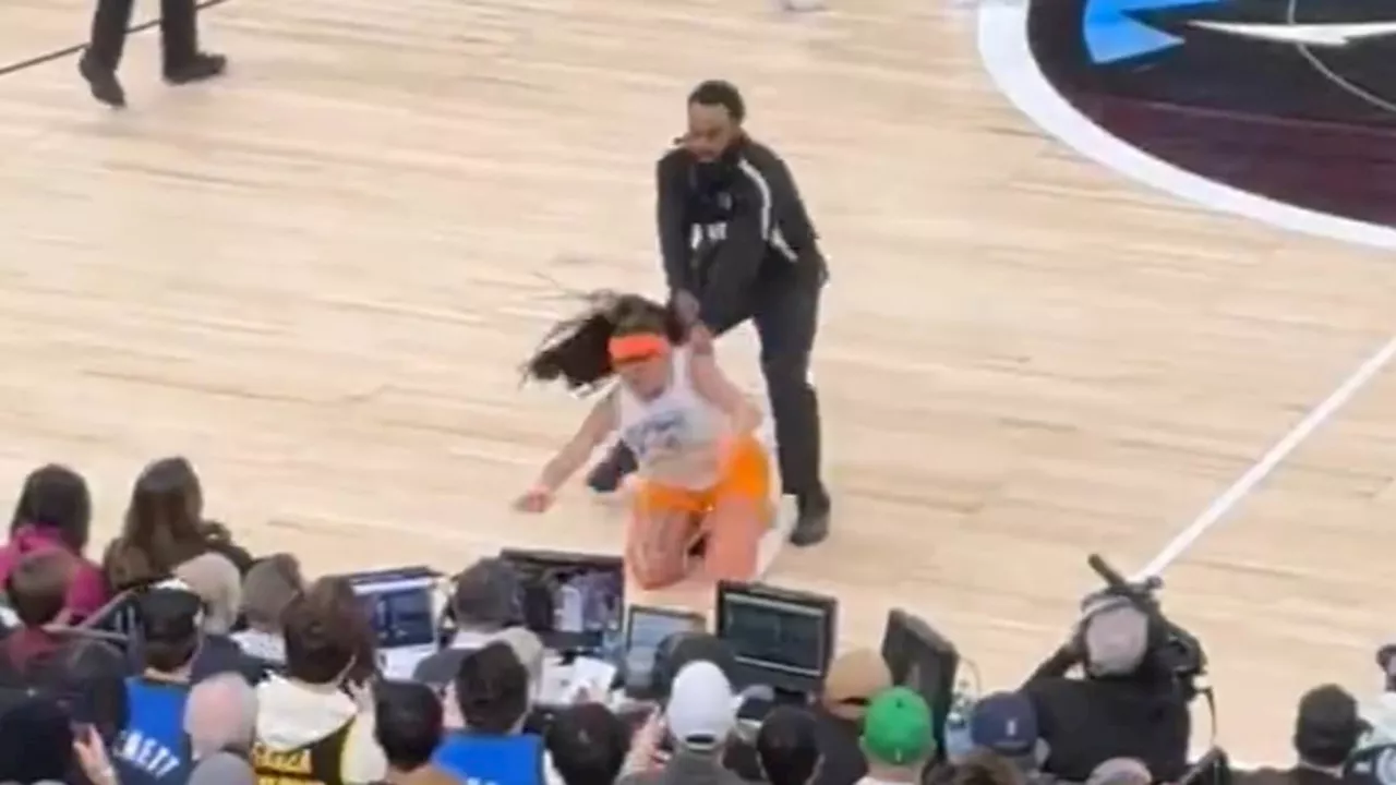 Instagram models tackled to ground by NBA security after storming onto court as star player gets...