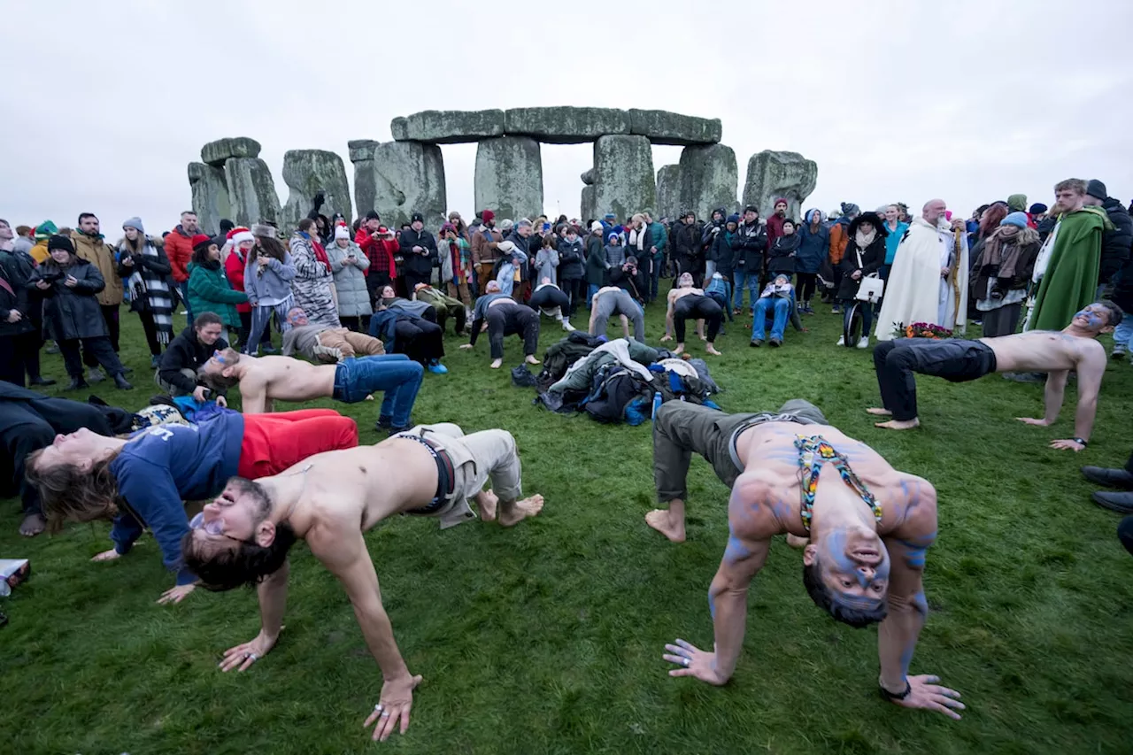 Winter solstice event at Stonehenge draws thousands of revellers