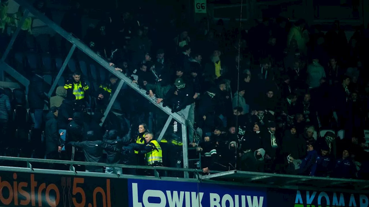 Chaos in Almelo: fan valt uit uitvak, duel Heracles-Groningen gestaakt na onrust