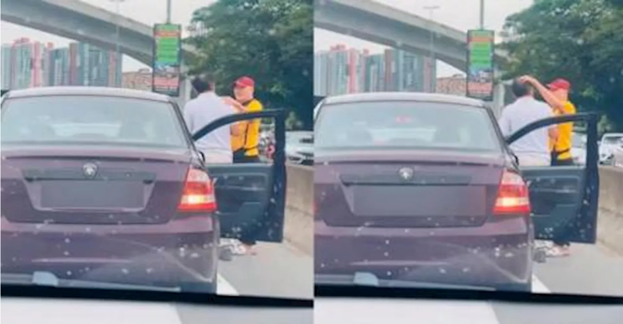 Malaysian hits luxury car, owner calmly pats his head