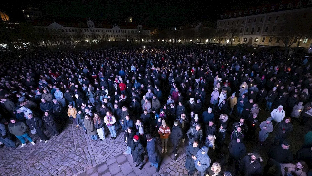 Germans mourn the 5 killed and 200 injured in the apparent attack on a Christmas market