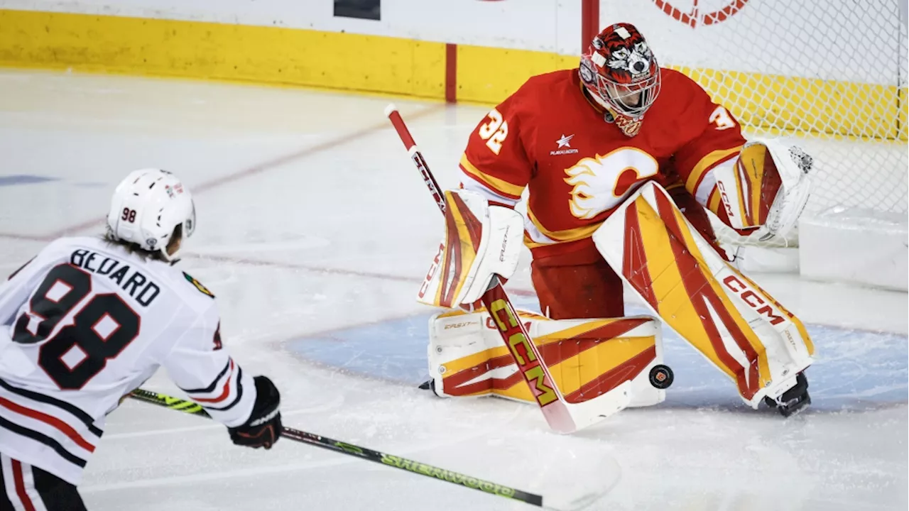 Flames get goals from 6 players in a 6-4 victory over the Blackhawks