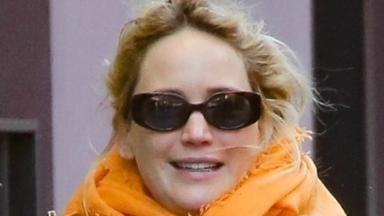 Pregnant Jennifer Lawrence bundles up in trench coat for chilly NYC stroll