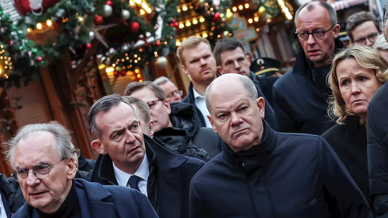 Moment German chancellor Olaf Scholz is heckled by angry mob in Magdeburg as questions remain over...