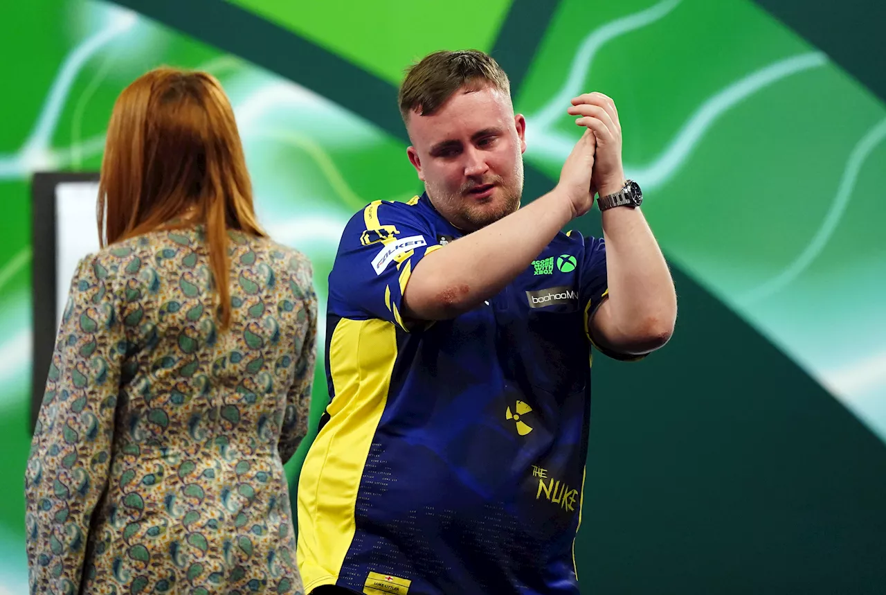 A tearful Luke Littler gets his World Darts Championship under way in sensational fashion