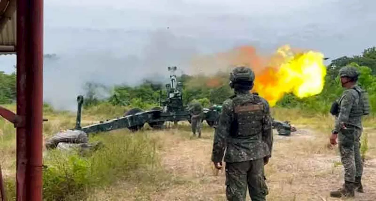 Army artillery troops test Marine howitzers