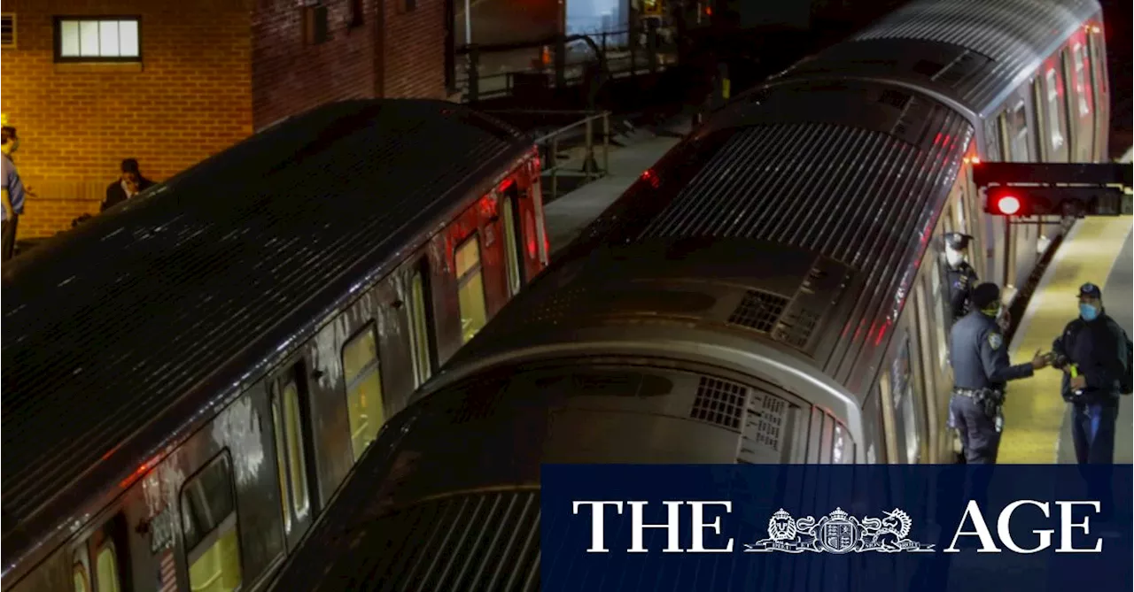 New York City police investigate the death of a woman found on fire in subway car