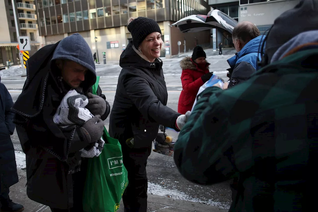 Ottawa Outreach Worker Hands Out Supplies to Unhoused People on a Cold December Day