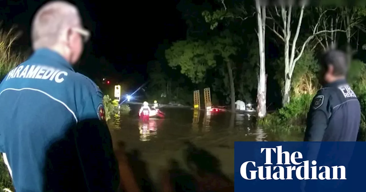 Children rescued after clinging to tree for hours in Queensland flood waters
