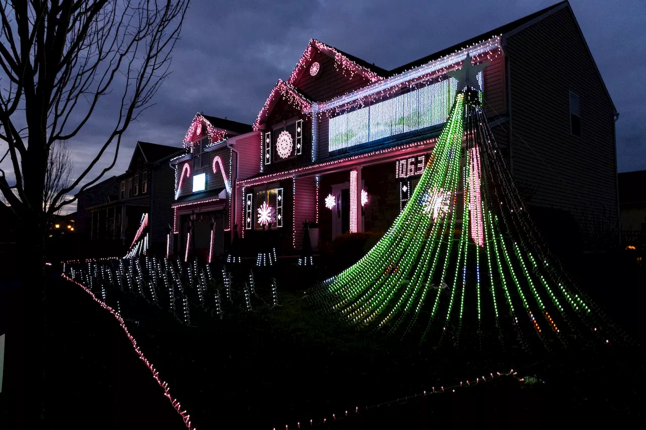 Home Decorated With Christmas Lights Synced to Music