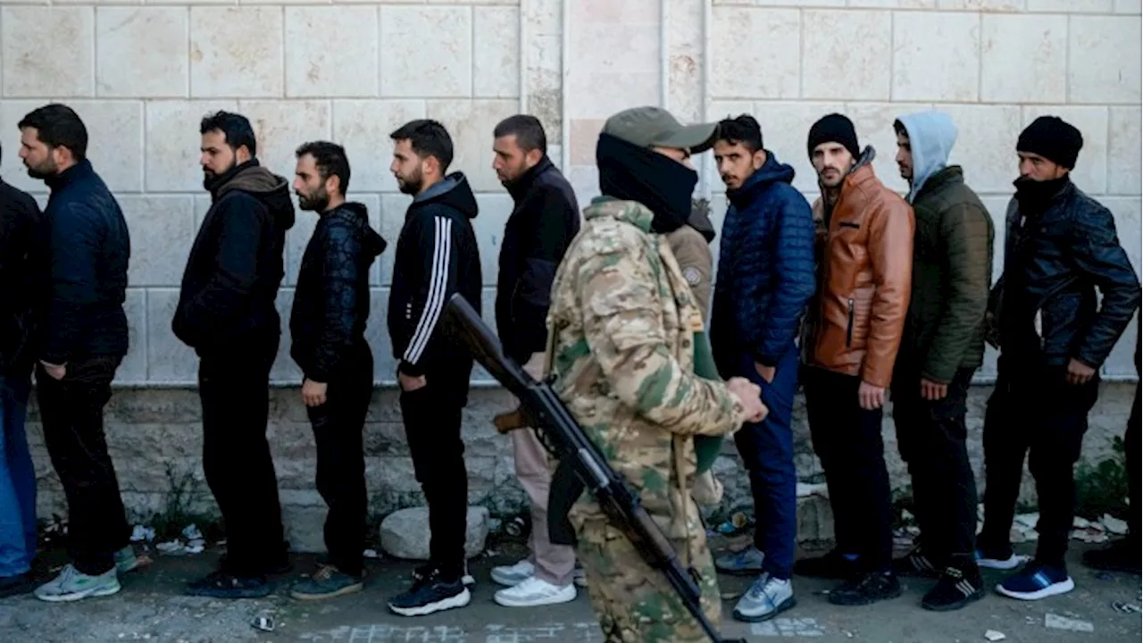 Syria's New Rulers Seek to Disarm Assad Loyalists, but Fear Grows Among Minority Groups