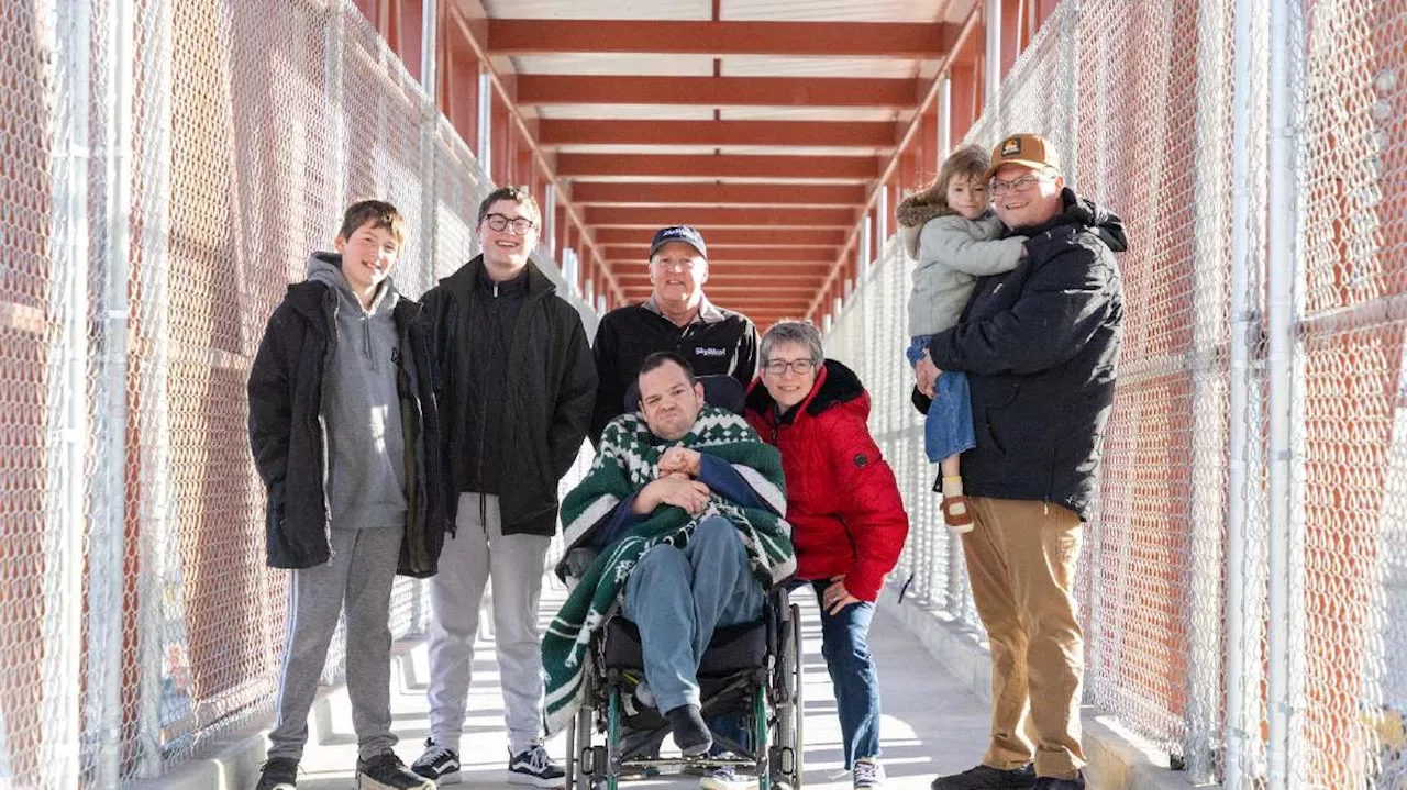 Chesley Family First to Cross New Pedestrian Bridge over Bangerter Highway