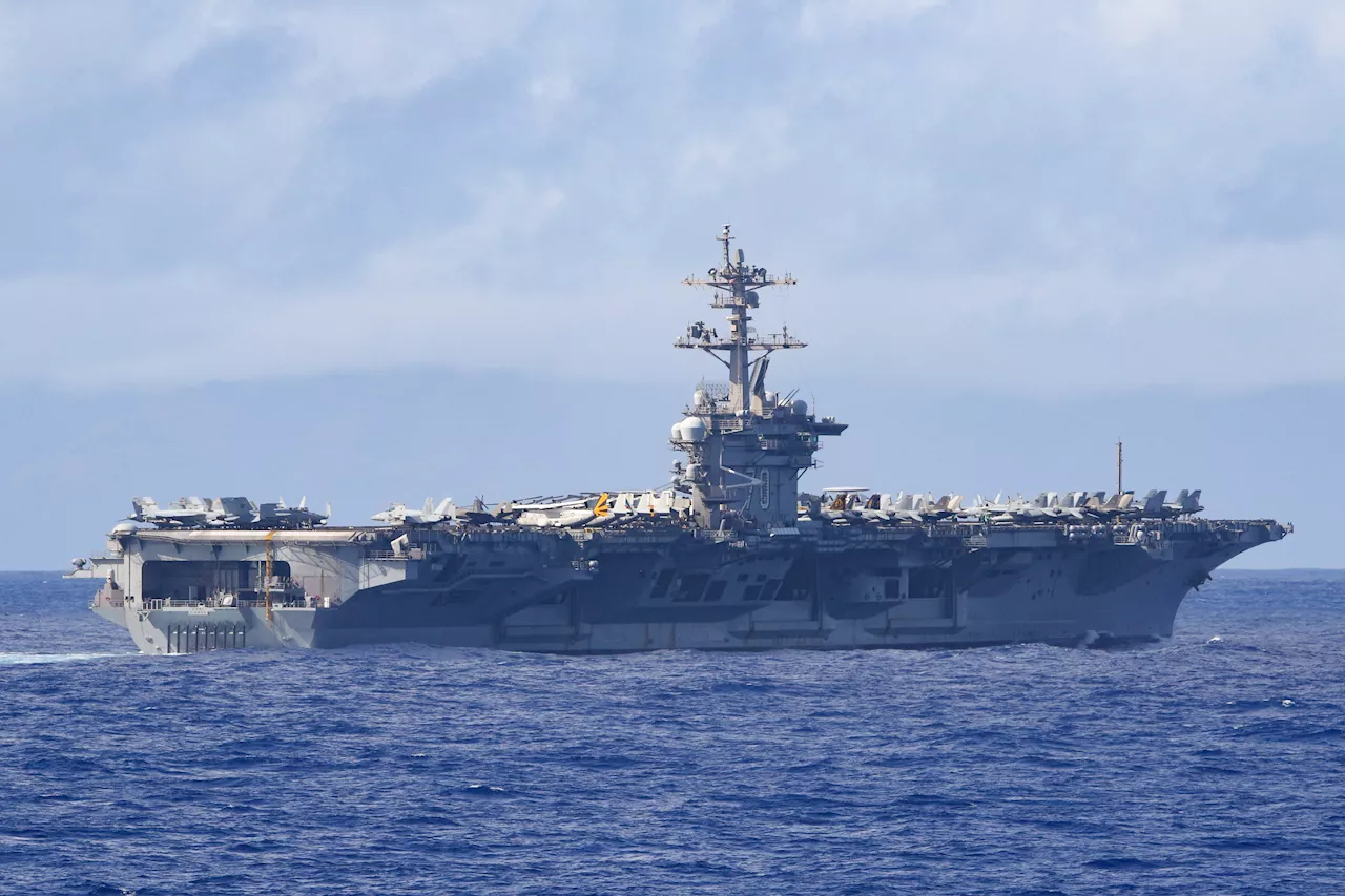 US Navy Strike Group Led by Aircraft Carrier Sails Towards South China Sea