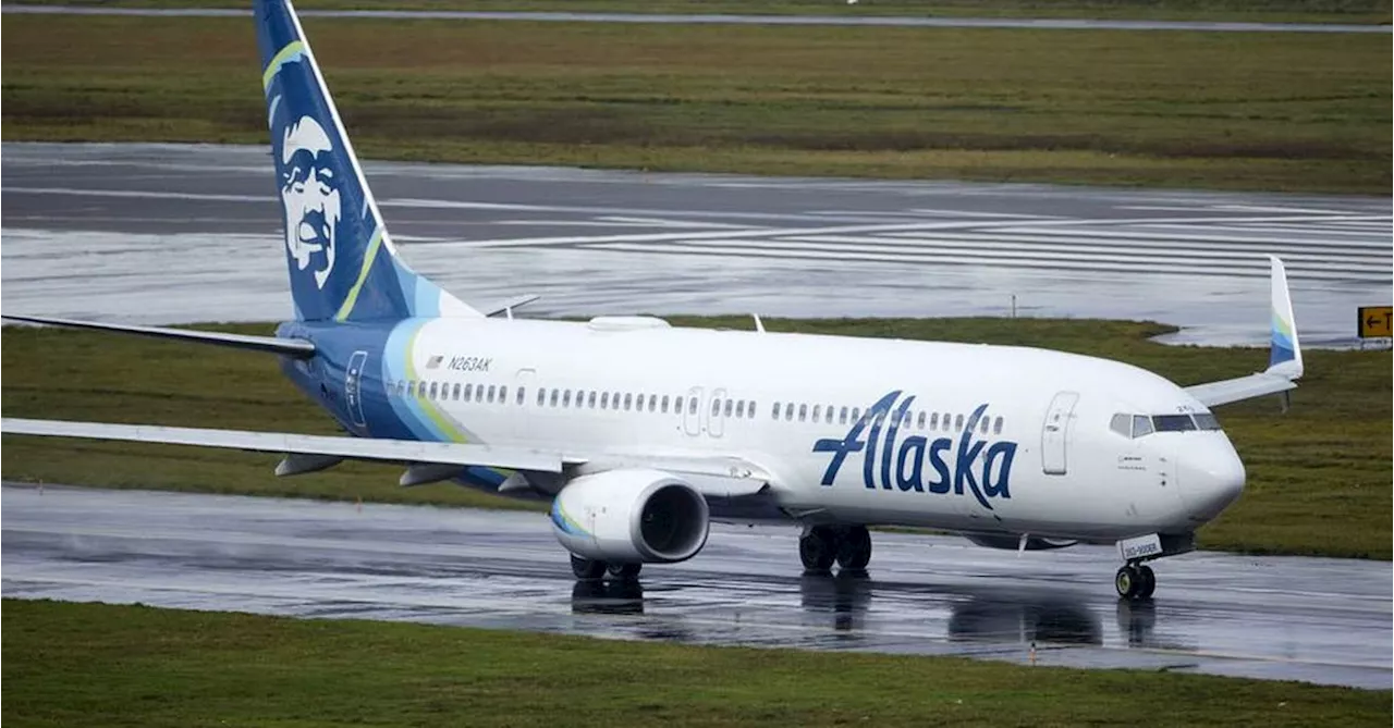 Anxious Passenger Steps Onto Wing of Alaska Airlines Jet