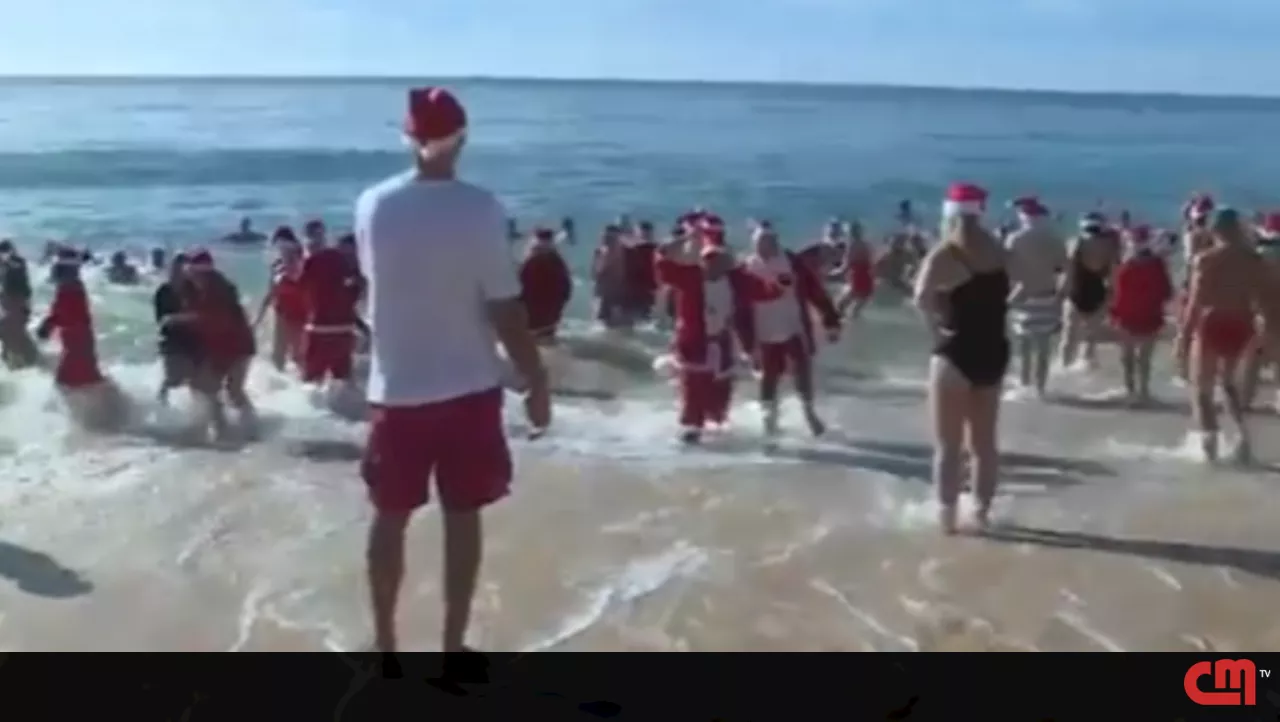 Várias pessoas juntam-se em praia de Armação de Pêra para mergulho solidário