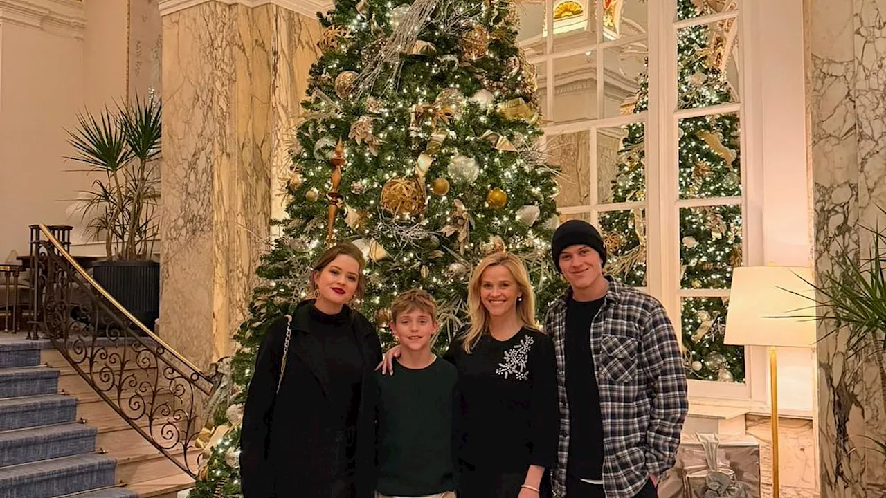 Reese Witherspoon's son Deacon, 21, towers over her in sweet family Christmas portrait