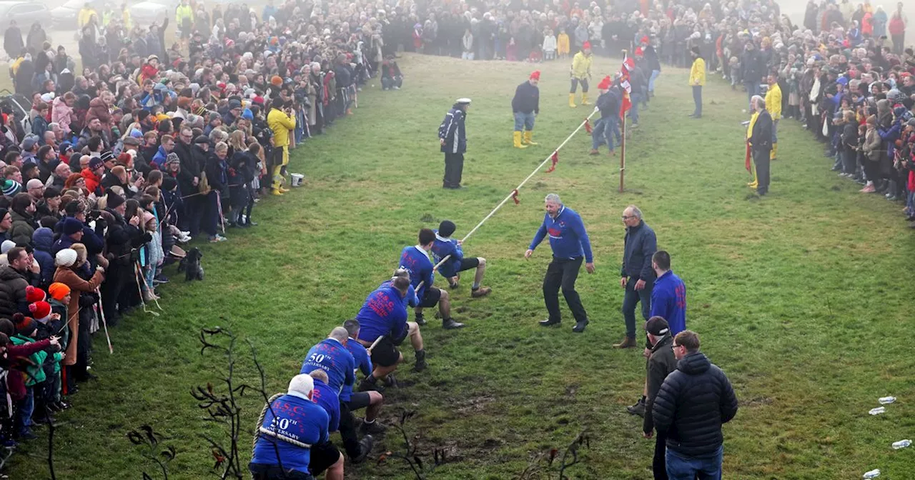 Hundreds of people cheer on Boxing Day tug of war in heavy fog