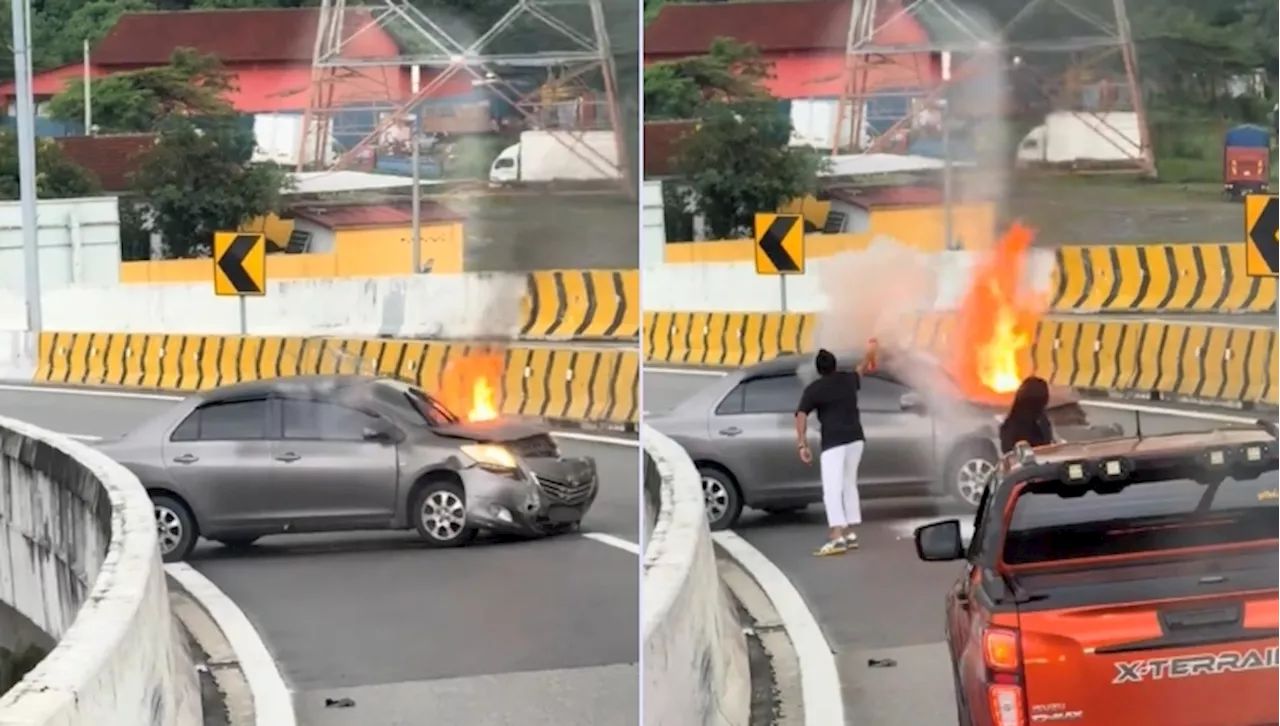 Composure Amidst Car Fire in Kuala Lumpur