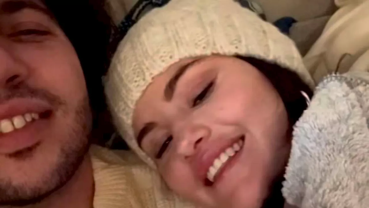 Selena Gomez flashes engagement ring as she and fiance Benny Blanco cuddle up to sing Christmas...