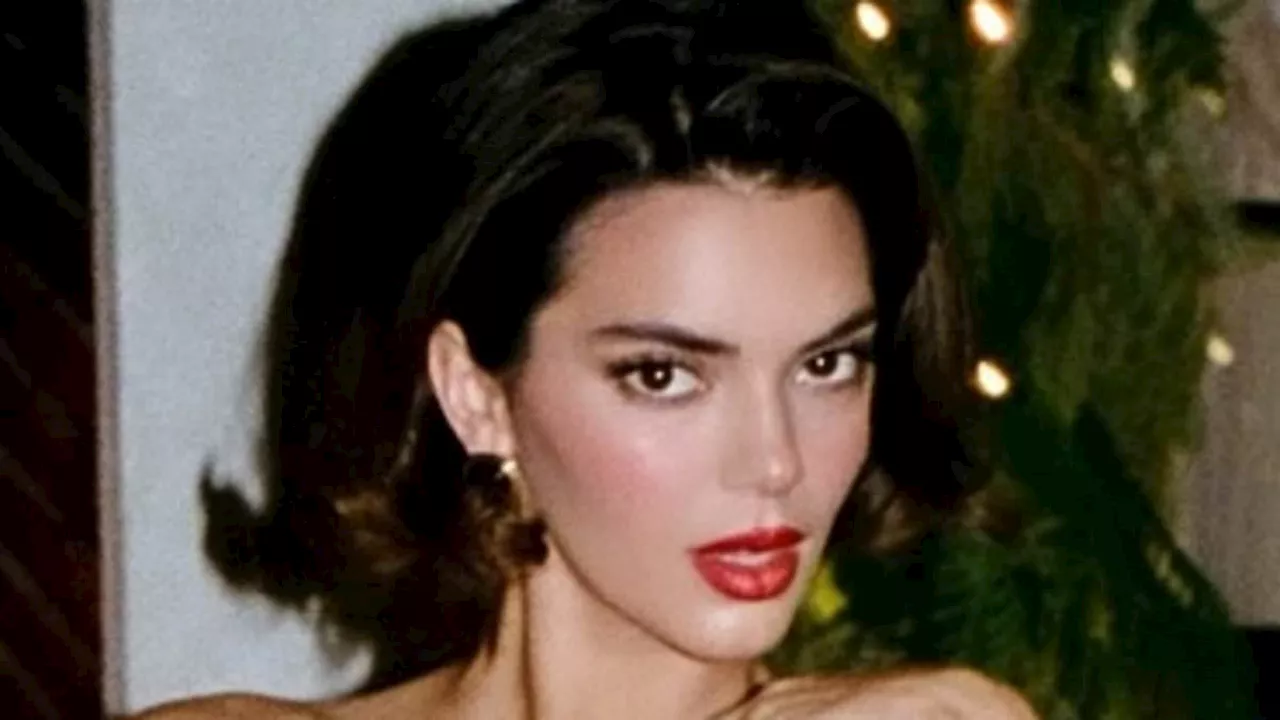 Kendall Jenner flashes a lot of leg in sequin frock and red heels for festive holiday snap