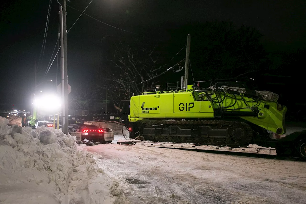 Heavy demolition equipment meets snowbank near old hospital site