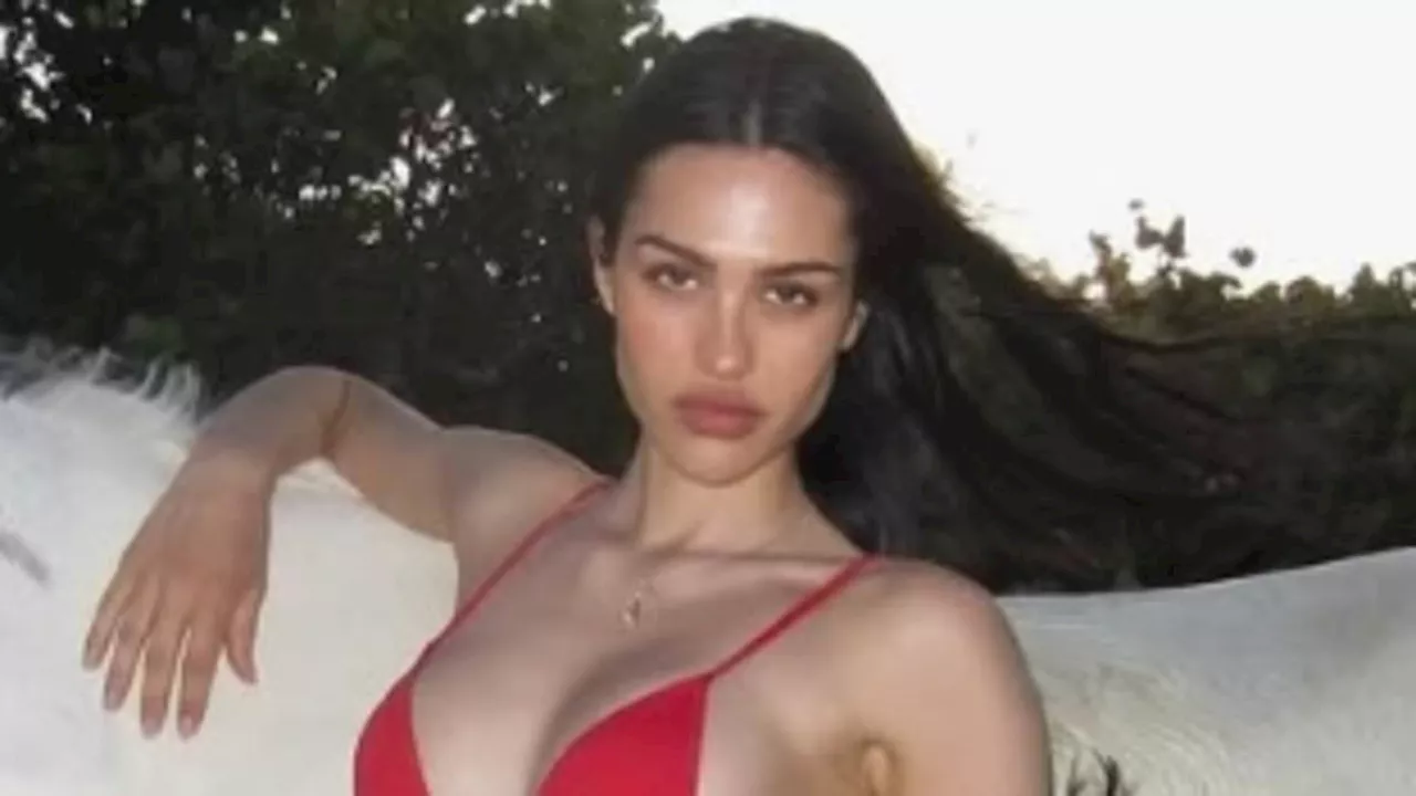 Amelia Gray Hamlin Shows Off Figure in Red Bikini While Cuddling Horses on Beach