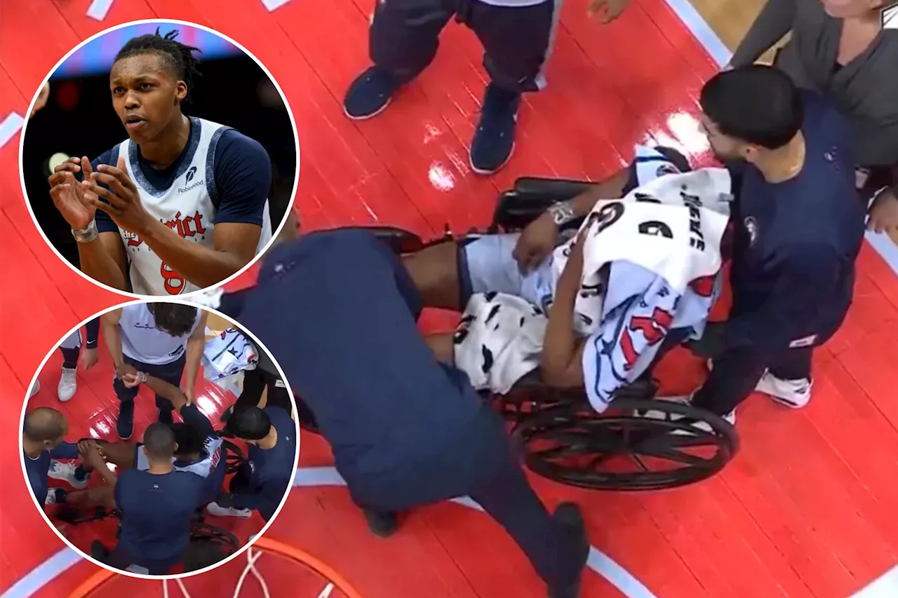 Wizards' Carlton Carrington exits in wheelchair after hitting head on court in scary injury scene