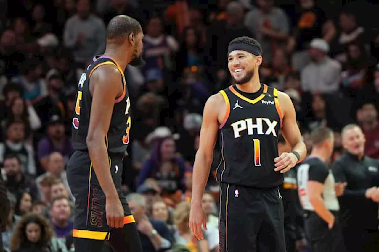 Booker scores 29 and Suns lose Durant to ankle injury in 104-93 win over Spurs