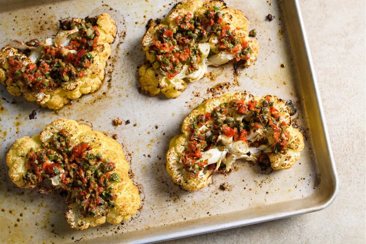 Nutty Parmesan, briny capers and pickled peppers turn cauliflower steaks into a satisfying main