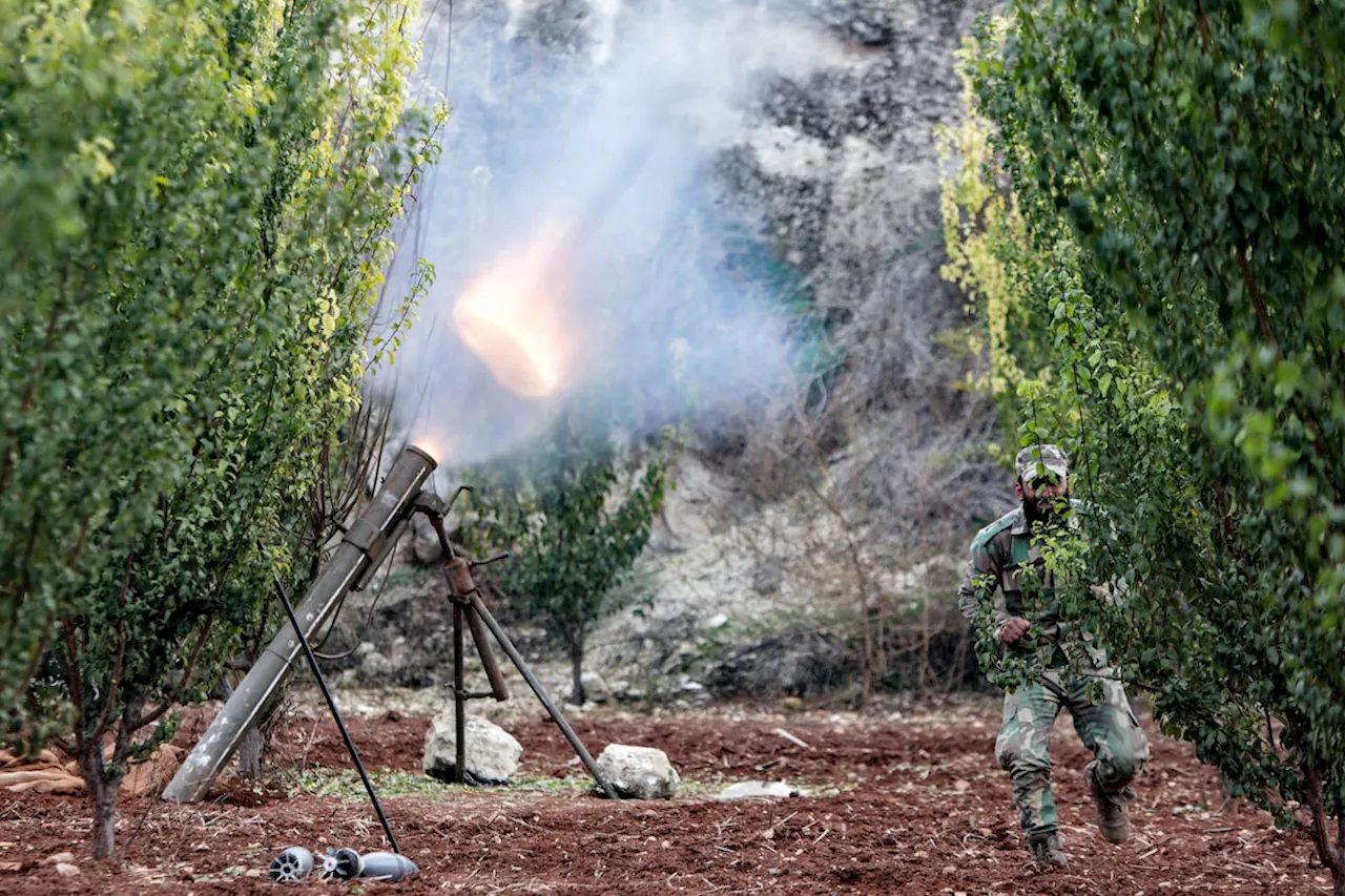 Syrian rebels say they are pushing into Hama city; army says defences holding