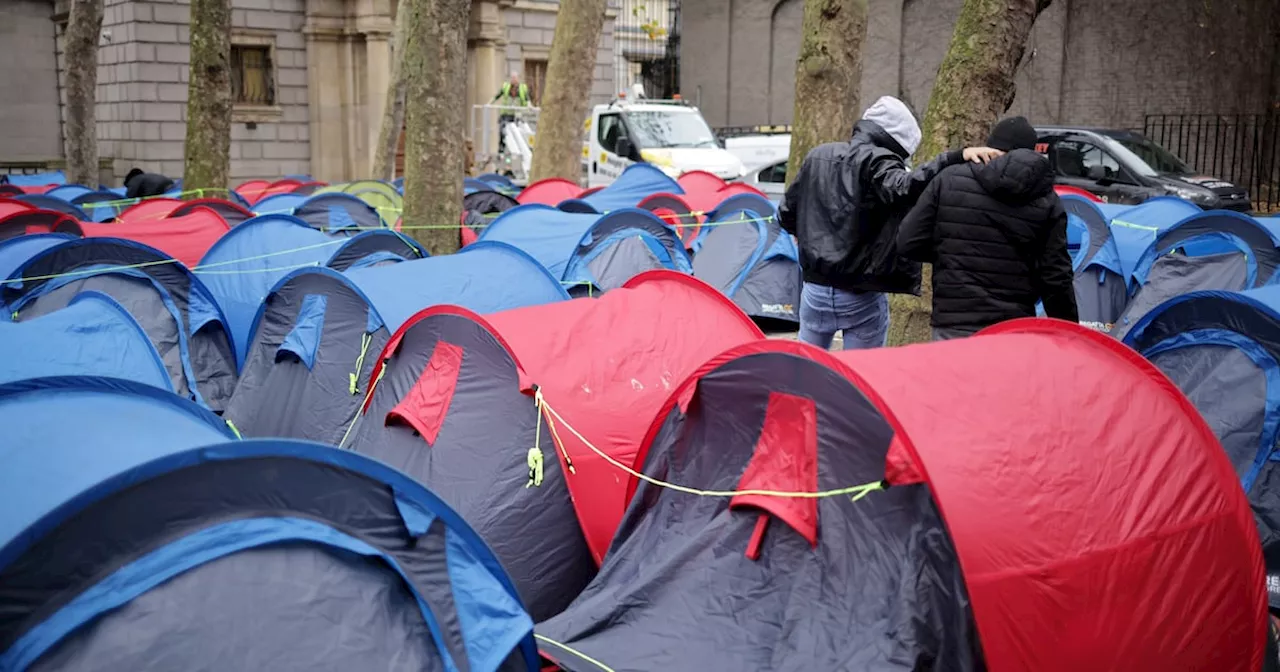 Homeless asylum seekers camped near Dáil offered accommodation after standoff with gardaí