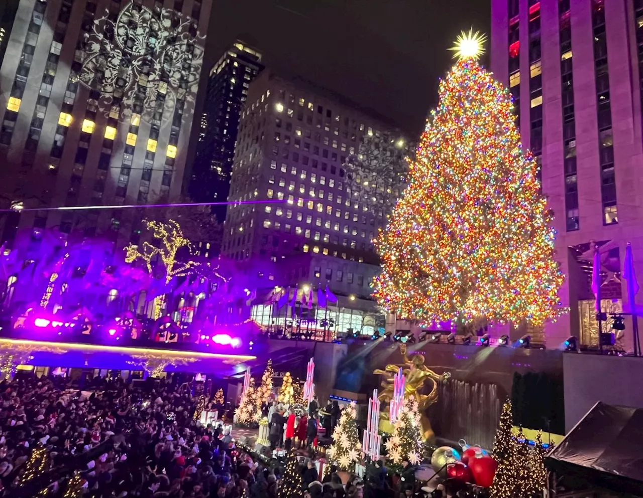 The Rockefeller Center Christmas Tree lights with over 50,000 LEDs in star-studded snowy event