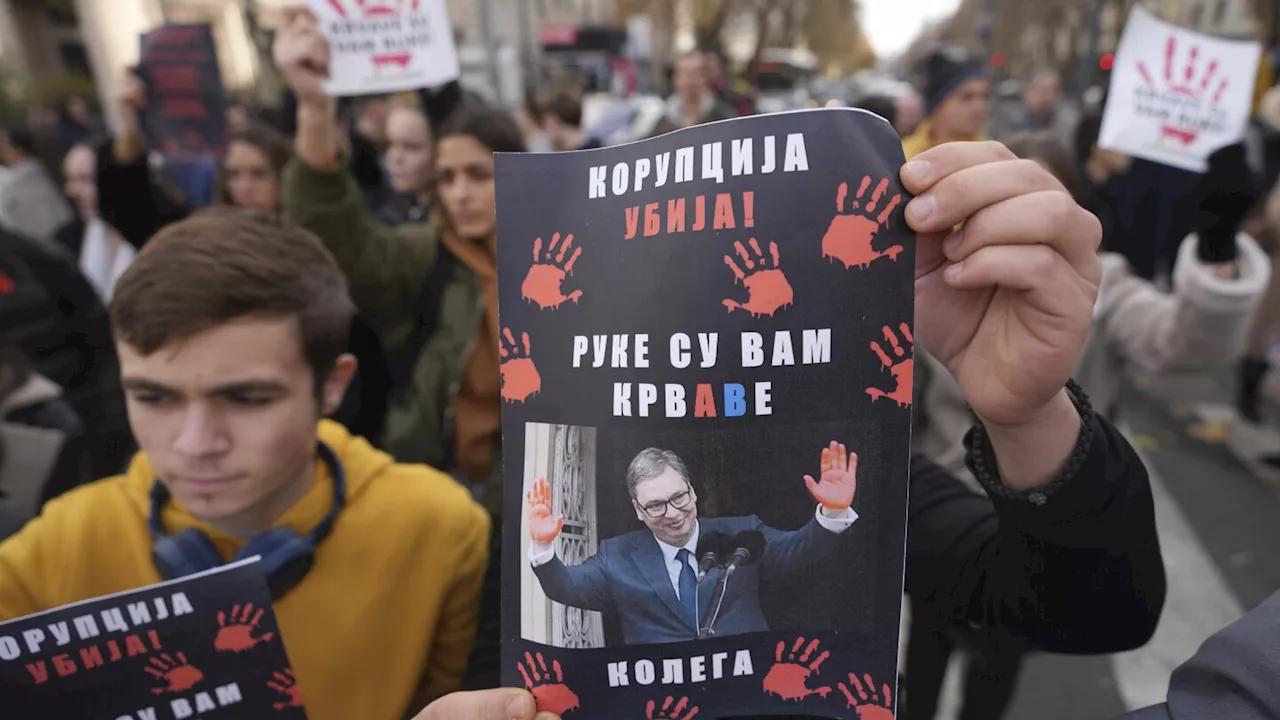 Car rams and injures orchestral musicians in Belgrade during a protest over station roof collapse