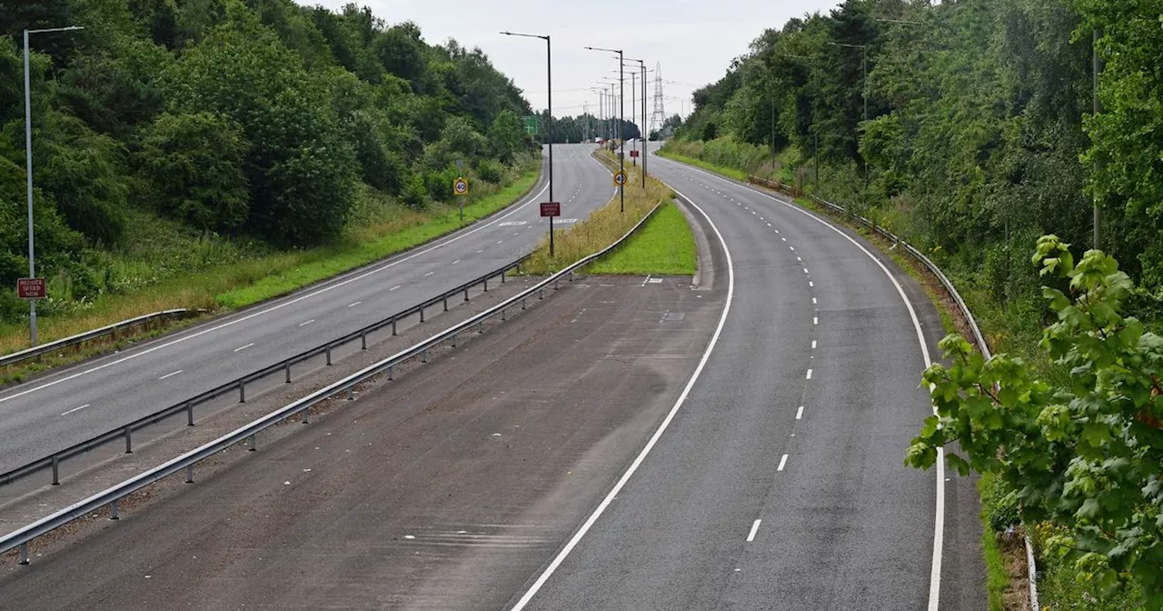 Police close main road after reports of person on bridge