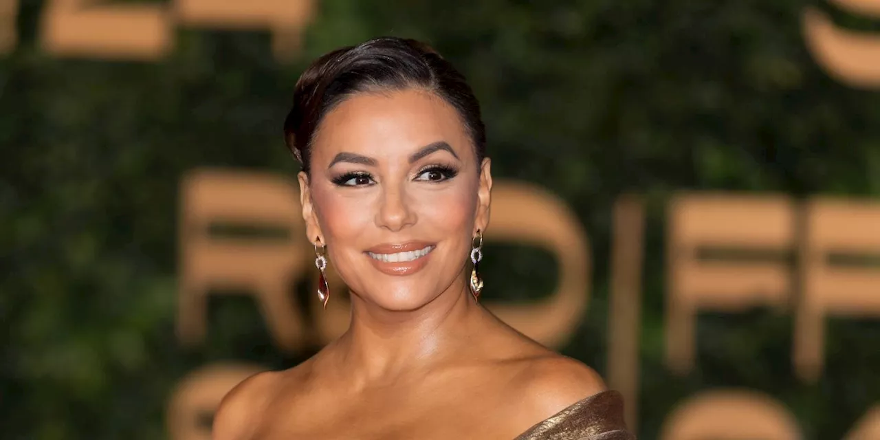 Eva Longoria's Plunging Metallic Gold Gown Is Perfect for the Holidays