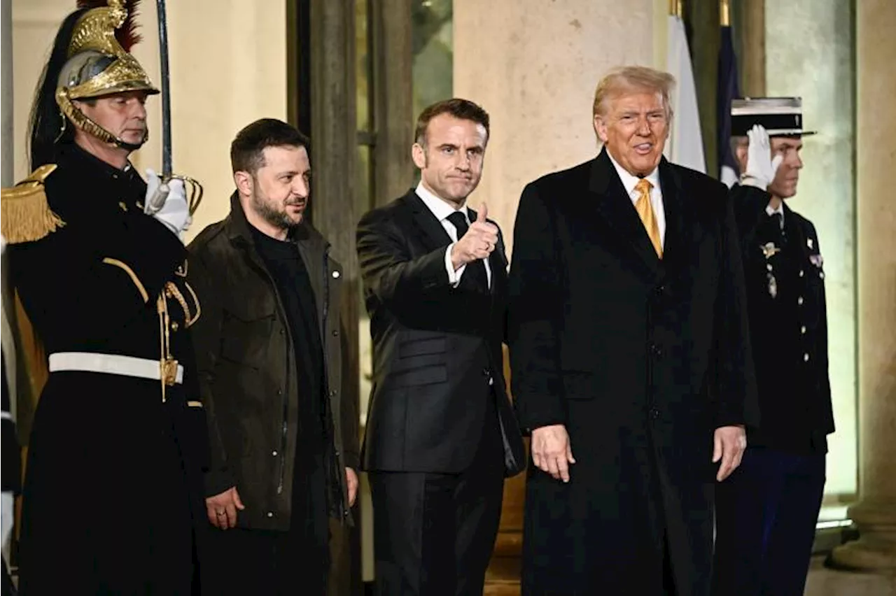 Trump says world 'a little crazy' as he meets Macron in Paris