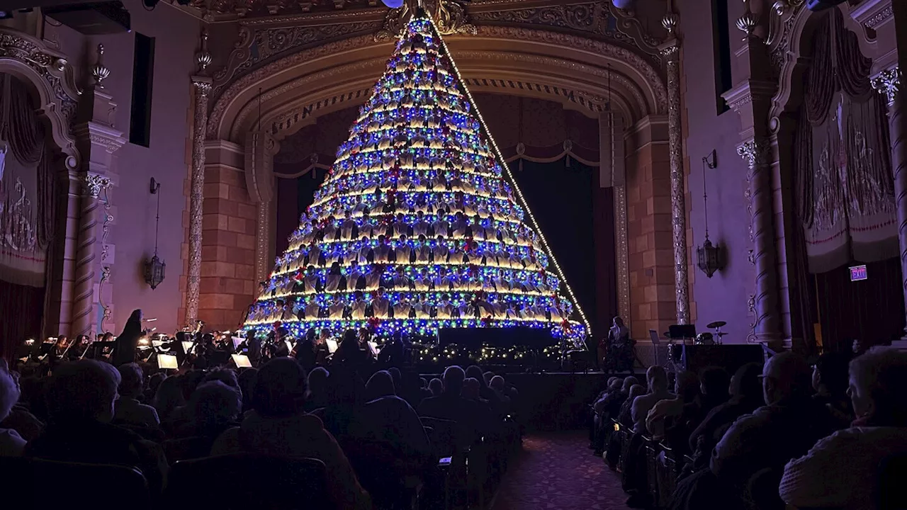 Michigan high school choir belts out holiday tunes from a towering Christmas tree