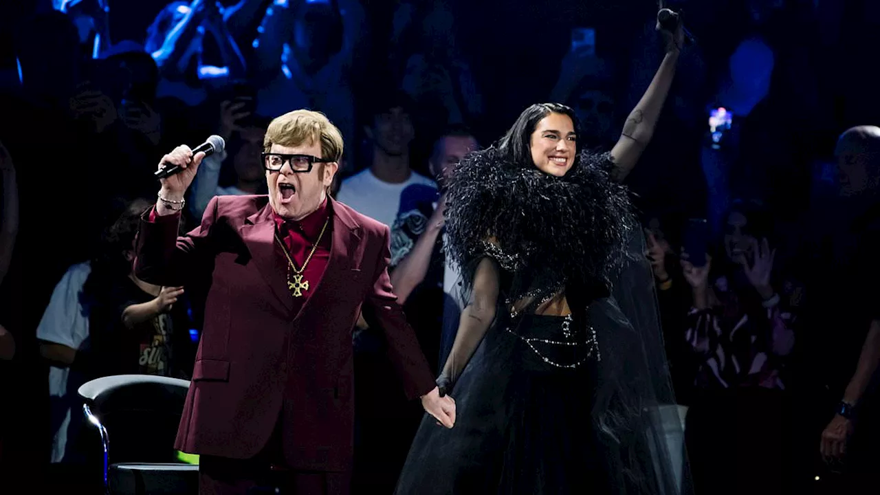 Elton John's emotional performance with Dua Lipa at the Royal Albert Hall: Guided off stage,...