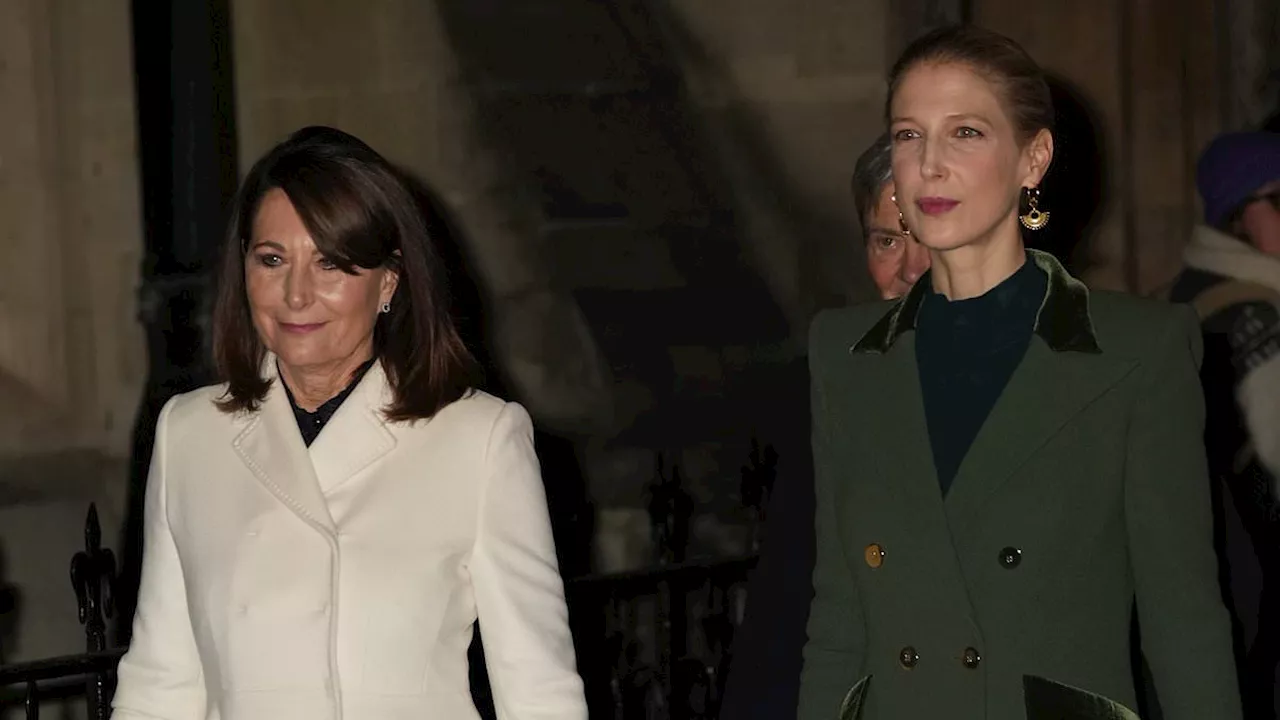 Lady Gabriella Windsor is supported by Carole Middleton at Kate's Christmas carol concert as she is...