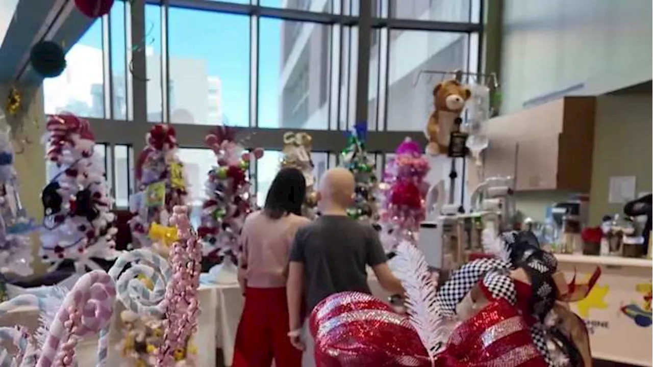 Young patients at MD Anderson Children’s Cancer Center Hospital pick their own Christmas Tree for their room