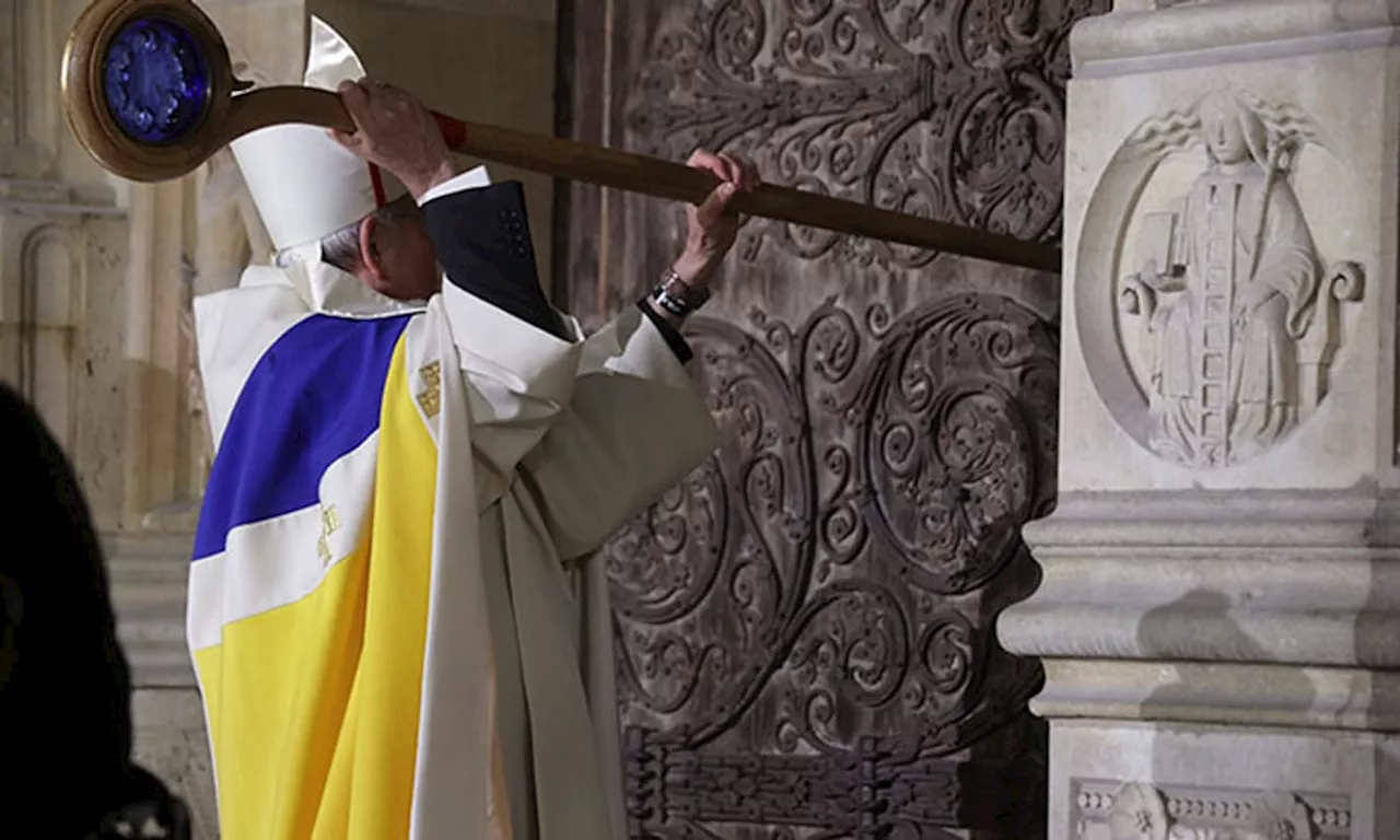 An archbishop's knock formally restores Notre Dame to life as winds howl and heads of state look on